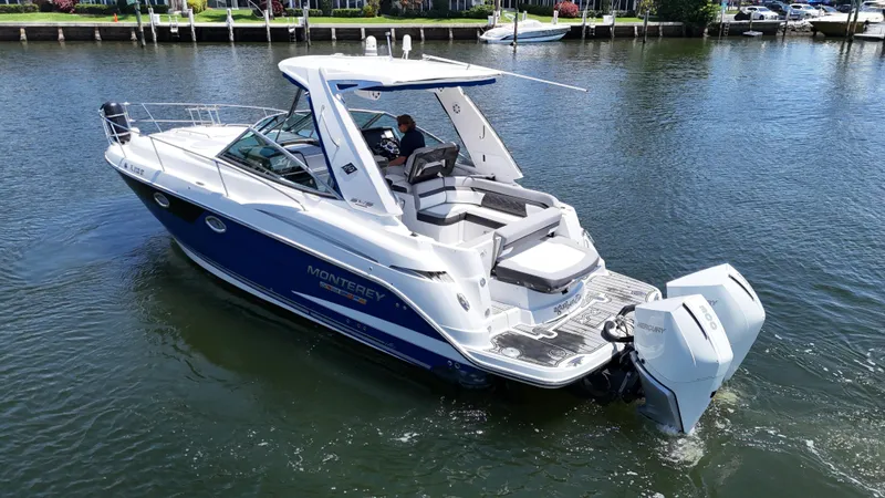 Aguabendita Yacht Photos Pics 2019 Monterey 345 Sport Yacht cruising on a calm waterway.
