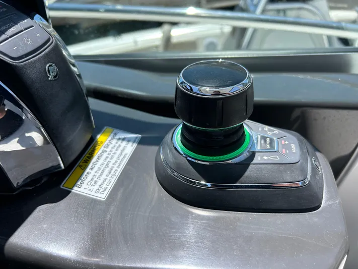 Aguabendita Yacht Photos Pics Joystick control on 2019 Monterey 345 Sport Yacht dashboard, close-up view.