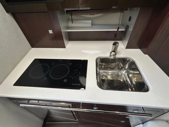Aguabendita Yacht Photos Pics Modern kitchen area in 2019 Monterey 345 Sport Yacht with stovetop and sink.