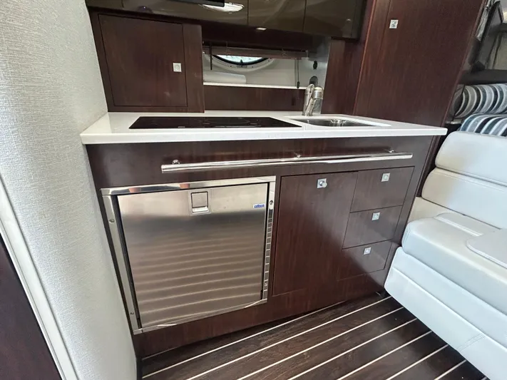 Aguabendita Yacht Photos Pics 2019 Monterey 345 Sport Yacht interior kitchen with modern appliances and sleek cabinetry.