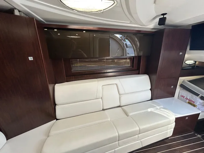 Aguabendita Yacht Photos Pics Interior of 2019 Monterey 345 Sport Yacht with white leather seating and wooden accents.
