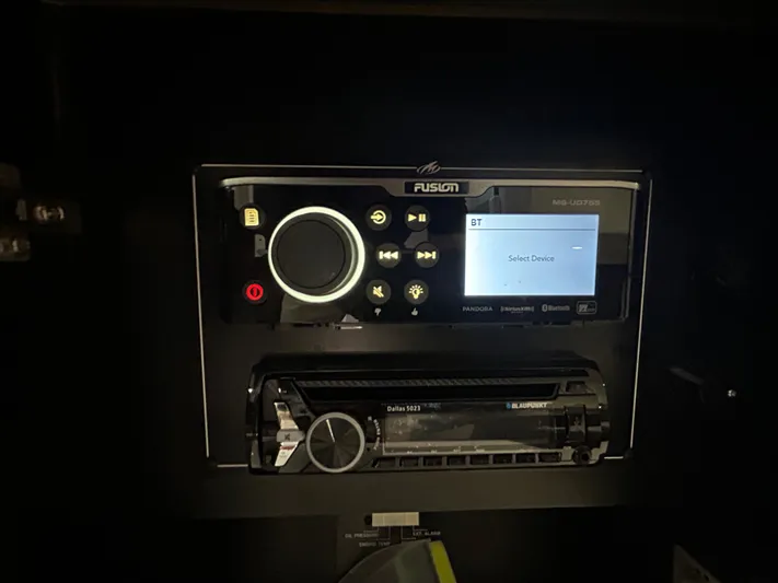 Aguabendita Yacht Photos Pics Fusion stereo system on a 2019 Monterey 345 Sport Yacht dashboard.