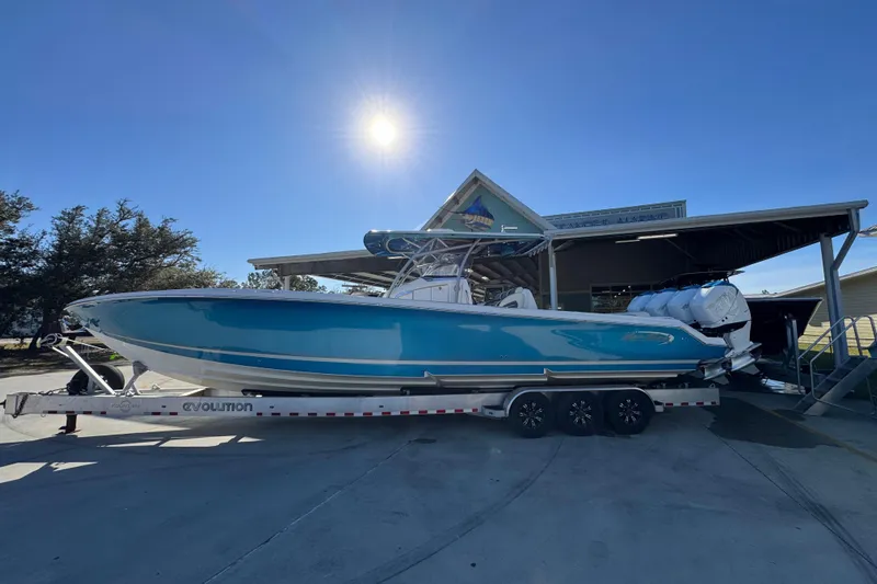  Yacht Photos Pics 2016 Nor-Tech 390 Sport Center Console boat on trailer under sunny sky.
