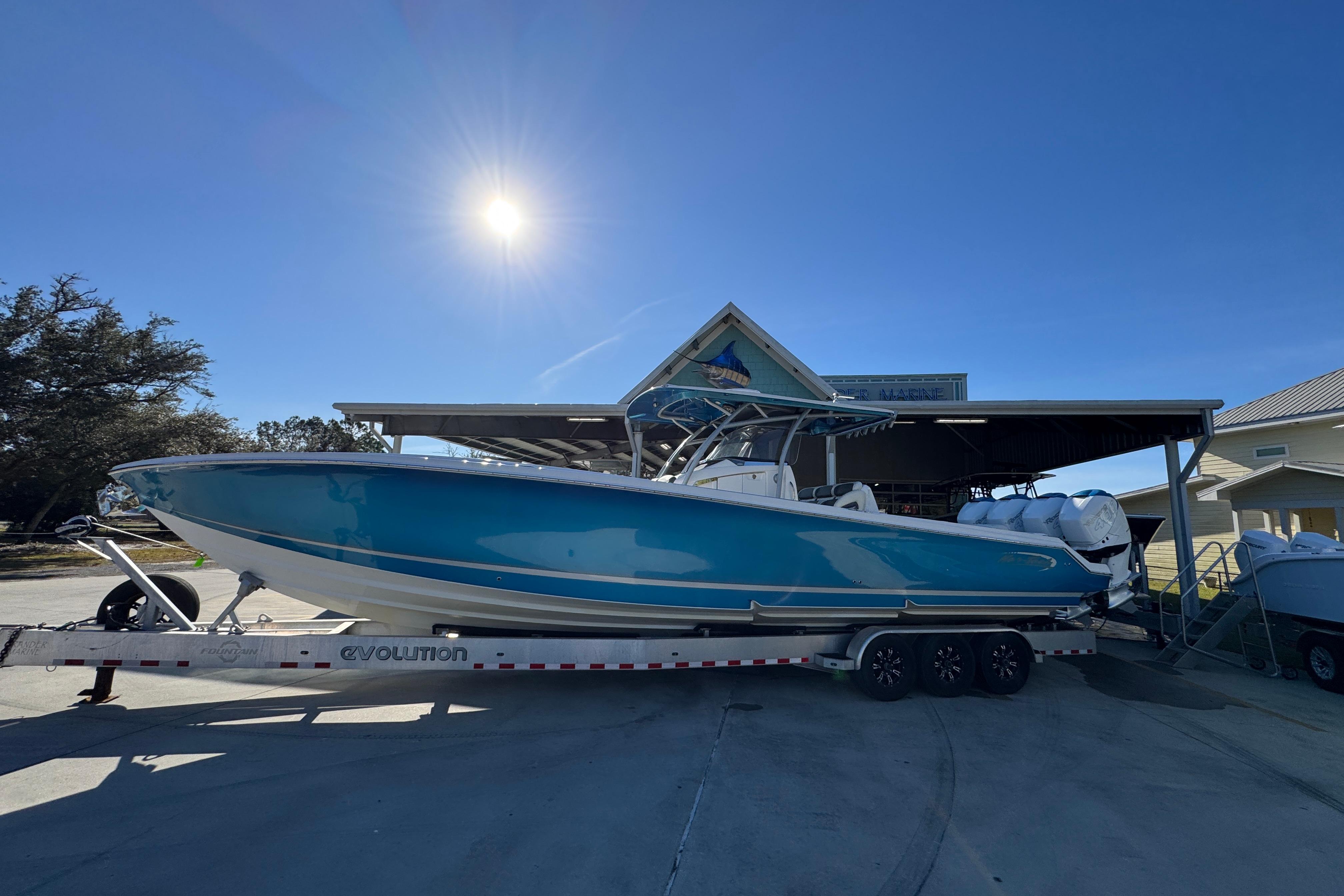 2016 Nor-Tech 390 Sport Center Console boat on trailer under sunny sky.