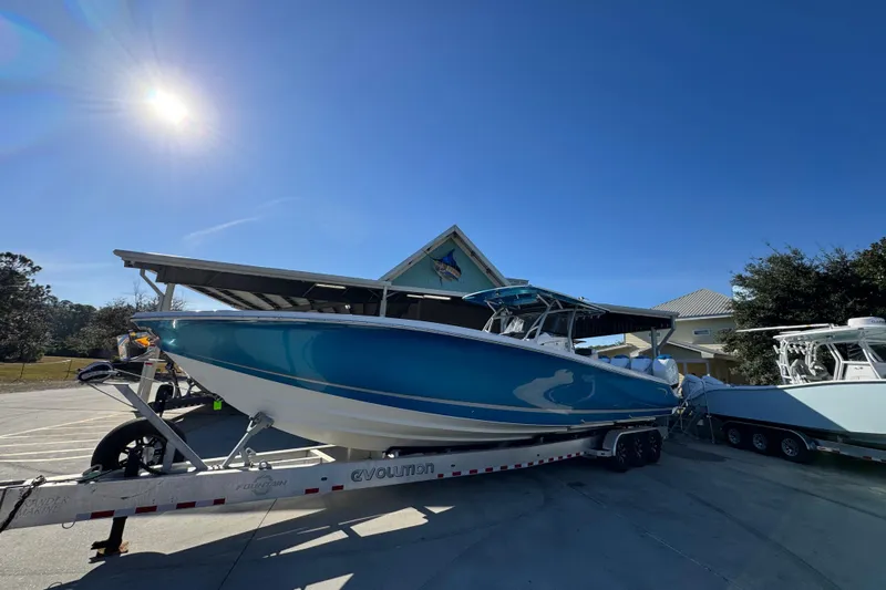  Yacht Photos Pics 2016 Nor-Tech 390 Sport Center Console boat on trailer under clear blue sky.