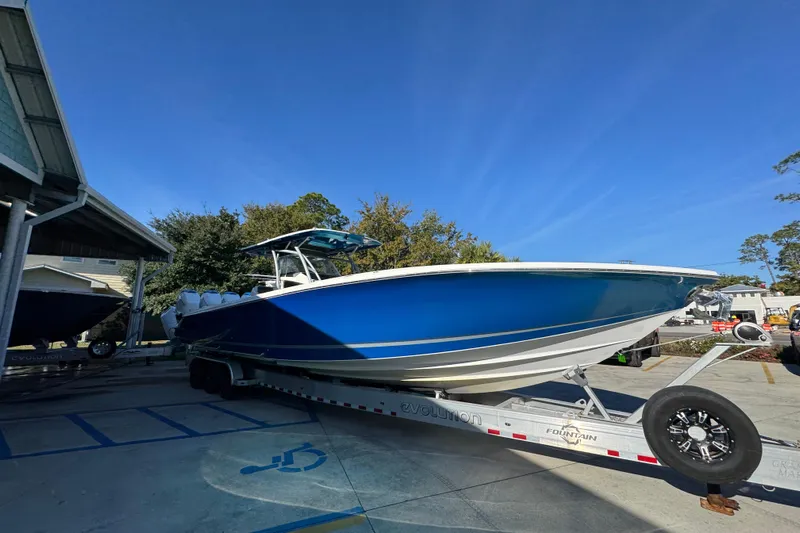  Yacht Photos Pics 2016 Nor-Tech 390 Sport Center Console boat on trailer, parked outdoors.