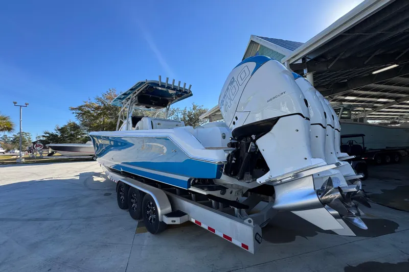  Yacht Photos Pics 2016 Nor-Tech 390 Sport Center Console boat with triple Mercury engines on a trailer.