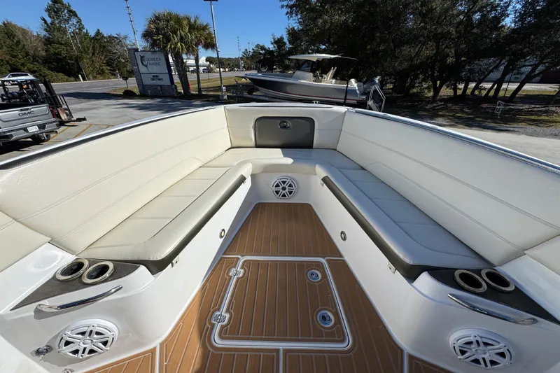  Yacht Photos Pics 2016 Nor-Tech 390 Sport Center Console boat interior with white seating and teak flooring.