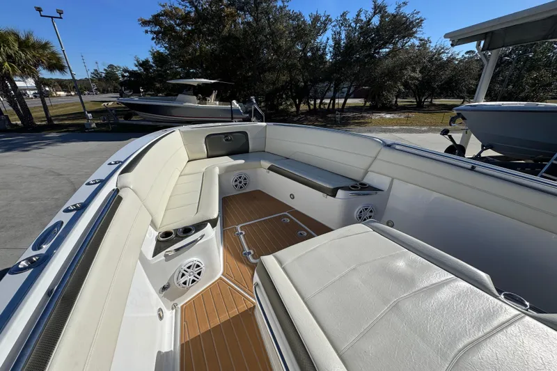  Yacht Photos Pics 2016 Nor-Tech 390 Sport Center Console boat interior with cushioned seating and speakers.