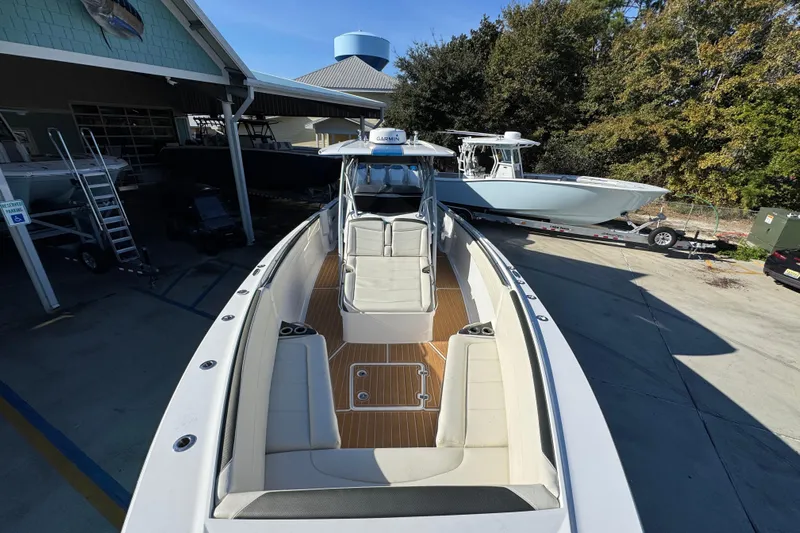  Yacht Photos Pics 2016 Nor-Tech 390 Sport Center Console boat with spacious seating, docked outdoors.