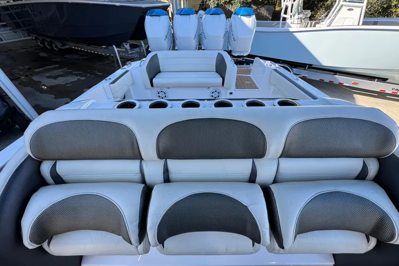  Yacht Photos Pics 2016 Nor-Tech 390 Sport Center Console with cushioned seating and multiple outboard engines.