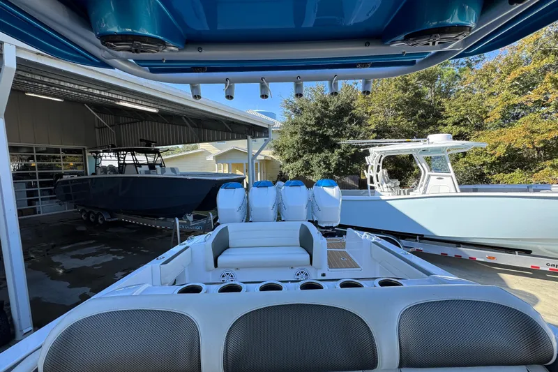  Yacht Photos Pics 2016 Nor-Tech 390 Sport Center Console boat with multiple engines in a marina.