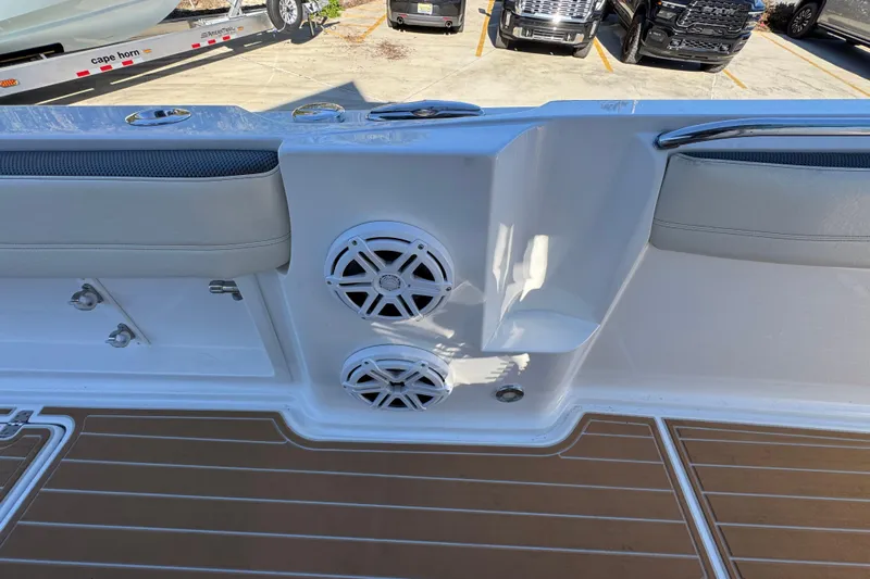  Yacht Photos Pics 2016 Nor-Tech 390 Sport Center Console boat interior with speakers and cushioned seating.