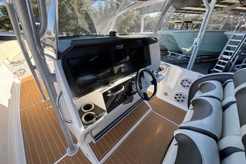  Yacht Photos Pics 2016 Nor-Tech 390 Sport Center Console boat interior with modern dashboard and seating.