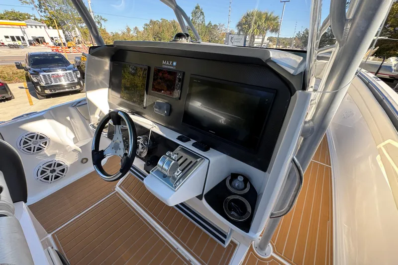  Yacht Photos Pics 2016 Nor-Tech 390 Sport Center Console helm with modern controls and dual displays.