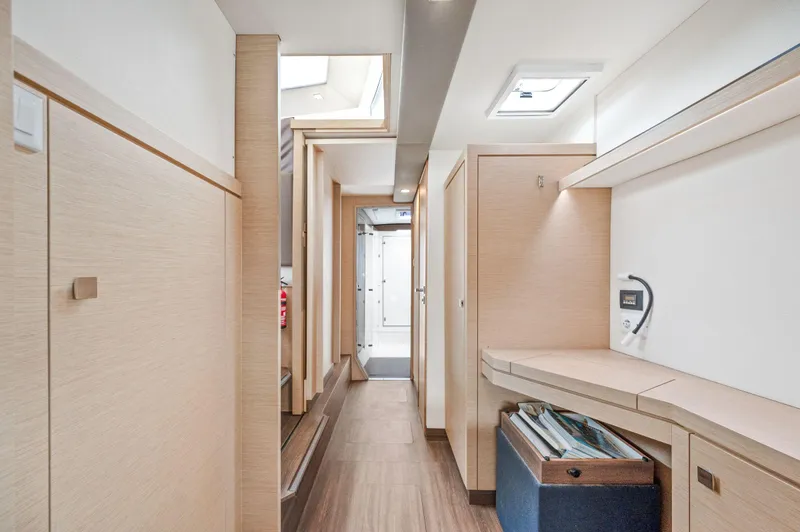 Sabai Sabai Yacht Photos Pics Interior of 2018 Fountaine Pajot Lucia 40 catamaran, featuring modern wood finishes and ample storage.