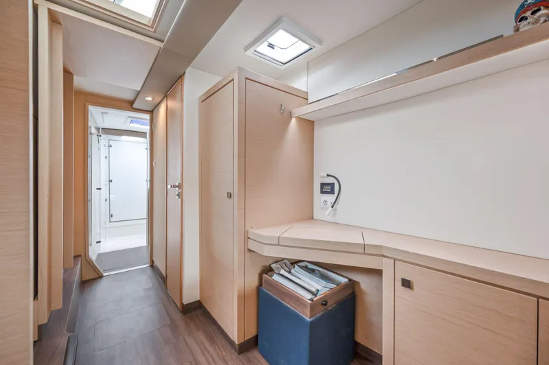 Sabai Sabai Yacht Photos Pics Interior of 2018 Fountaine Pajot Lucia 40 catamaran, featuring modern wood finish and ample storage.