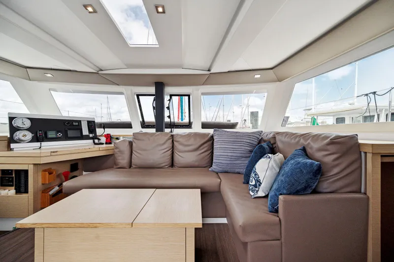 Sabai Sabai Yacht Photos Pics Interior of 2018 Fountaine Pajot Lucia 40 catamaran with modern seating and navigation equipment.
