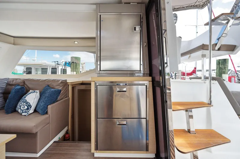 Sabai Sabai Yacht Photos Pics Interior of 2018 Fountaine Pajot Lucia 40 catamaran with modern kitchen and seating area.