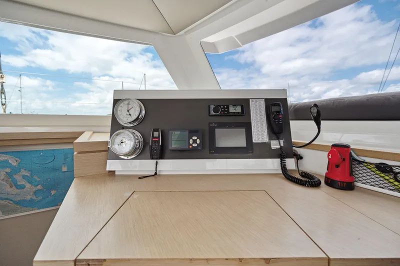 Sabai Sabai Yacht Photos Pics 2018 Fountaine Pajot Lucia 40 yacht helm with navigation instruments and controls.