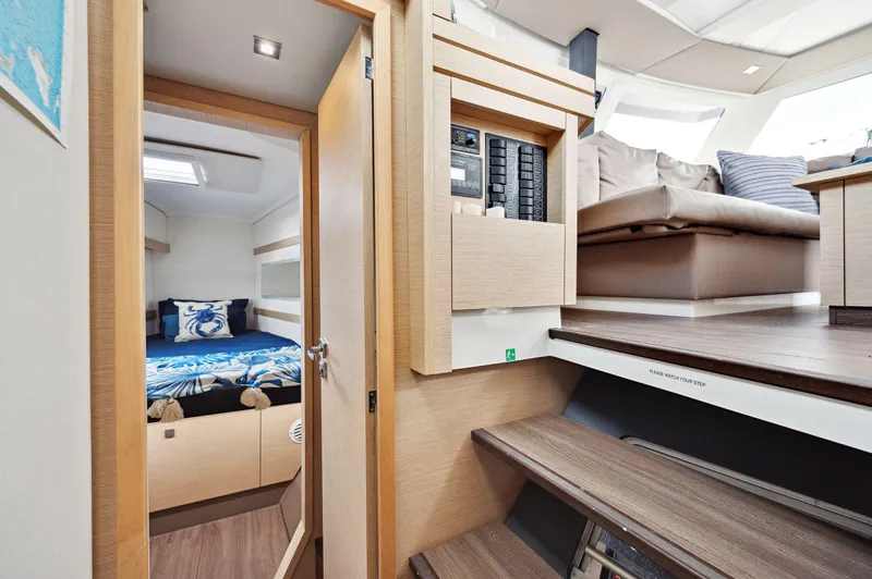 Sabai Sabai Yacht Photos Pics Interior of 2018 Fountaine Pajot Lucia 40 catamaran, featuring cozy cabin and modern living area.