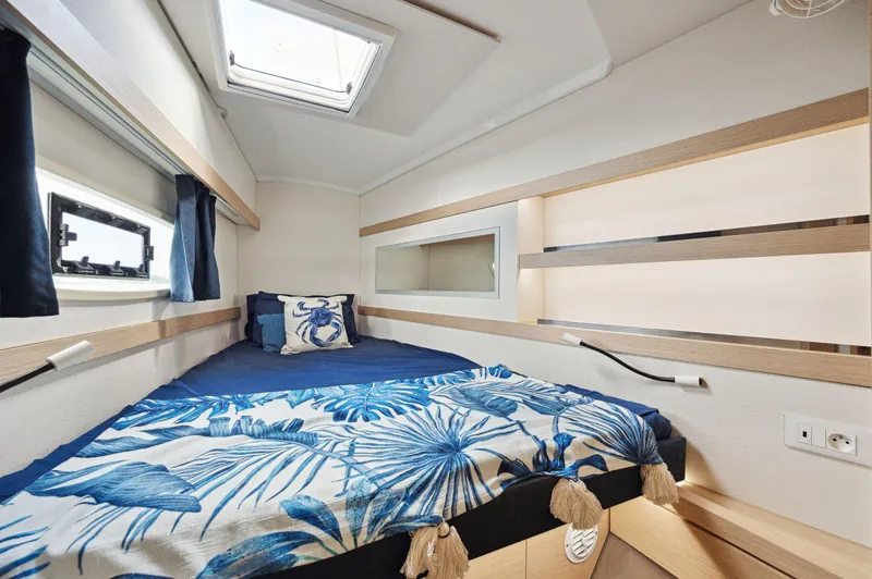 Sabai Sabai Yacht Photos Pics Cozy cabin interior of 2018 Fountaine Pajot Lucia 40 with nautical decor.