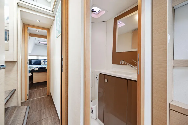 Sabai Sabai Yacht Photos Pics Interior of 2018 Fountaine Pajot Lucia 40 yacht, featuring modern bathroom and cozy cabin.