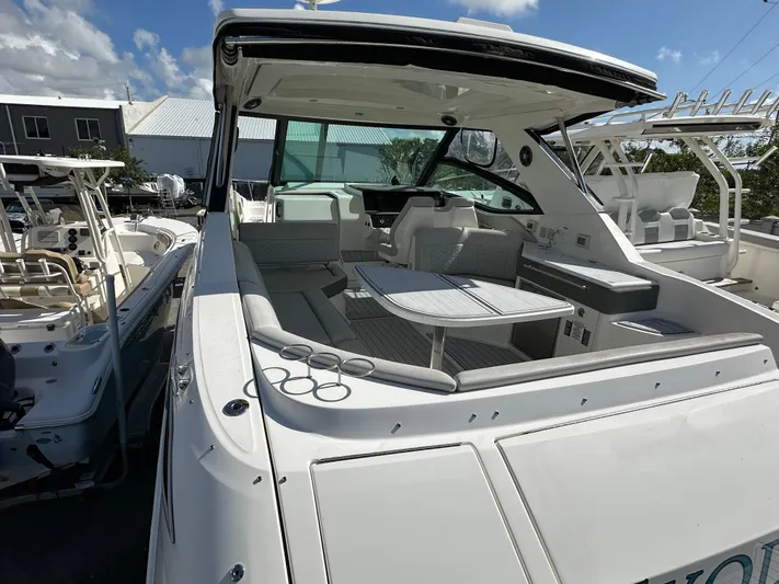  Yacht Photos Pics 2022 Sea Ray Sundancer 320 yacht with spacious deck and seating area.
