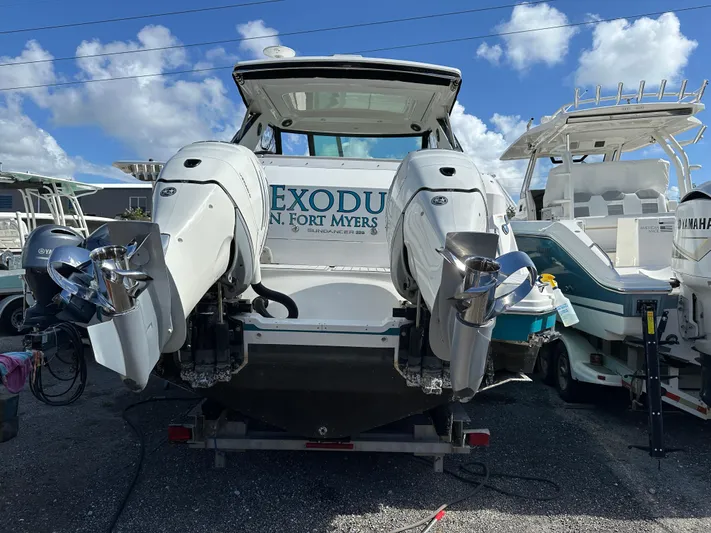  Yacht Photos Pics 2022 Sea Ray Sundancer 320 boat with dual engines, docked in Fort Myers under a clear sky.