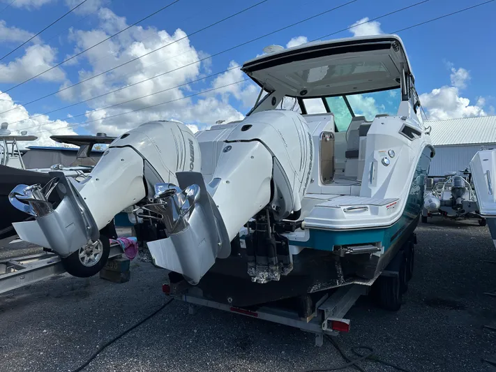  Yacht Photos Pics 2022 Sea Ray Sundancer 320 boat with dual outboard engines on a trailer.