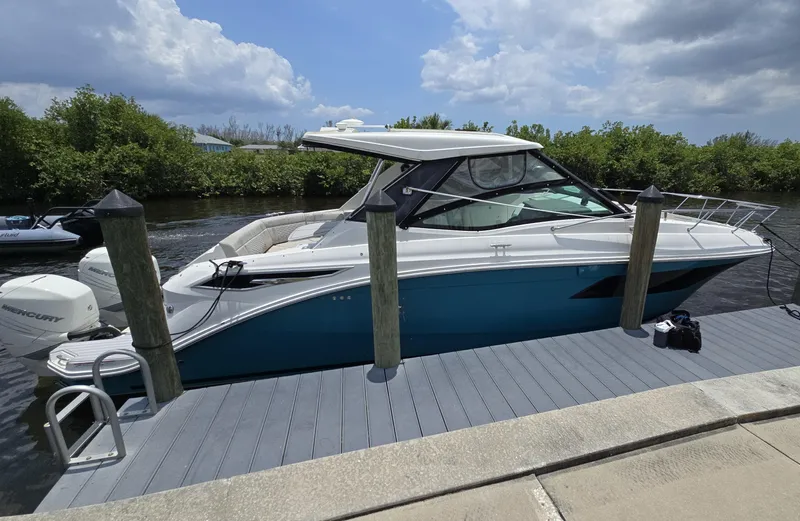  Yacht Photos Pics 2022 Sea Ray Sundancer 320 docked, featuring sleek design and modern amenities.