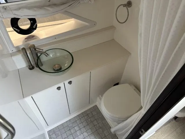  Yacht Photos Pics 2022 Sea Ray Sundancer 320 bathroom with modern sink and toilet.