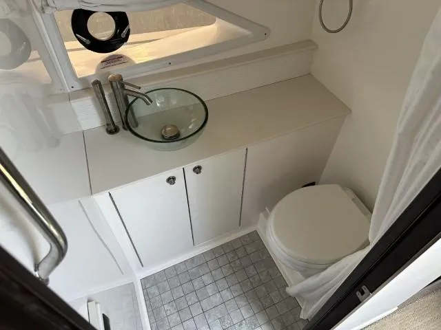  Yacht Photos Pics 2022 Sea Ray Sundancer 320 bathroom with modern sink and toilet.