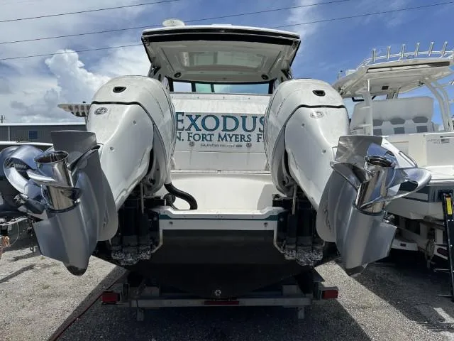  Yacht Photos Pics 2022 Sea Ray Sundancer 320 with dual outboard engines, rear view at dock.