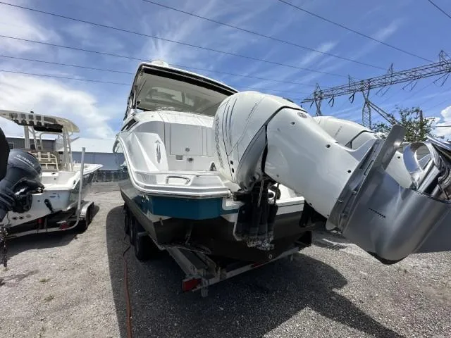  Yacht Photos Pics 2022 Sea Ray Sundancer 320 boat with powerful outboard engines, parked on a trailer.