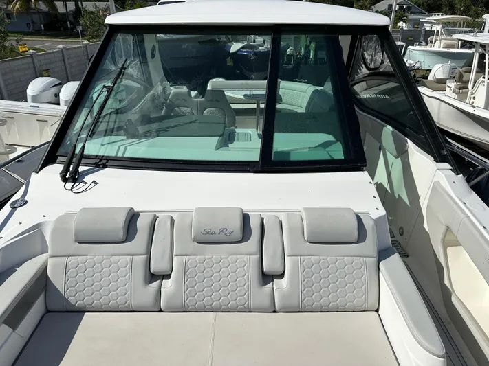  Yacht Photos Pics 2022 Sea Ray Sundancer 320 boat with sleek design and comfortable seating.