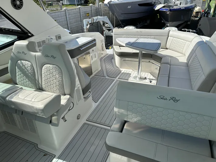  Yacht Photos Pics 2022 Sea Ray Sundancer 320 interior with luxurious seating and modern design.