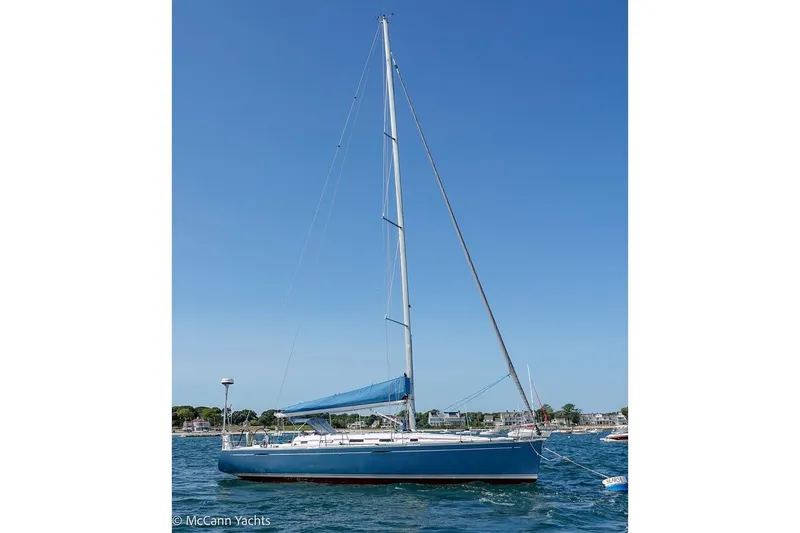  Yacht Photos Pics 2005 Beneteau First 44.7 sailboat on water under clear blue sky.