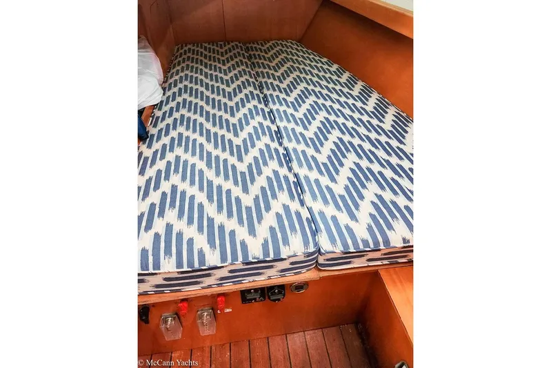  Yacht Photos Pics Interior cabin of 2005 Beneteau First 44.7 yacht with patterned cushions.