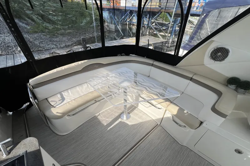  Yacht Photos Pics Interior of 2012 Sea Ray 370 Sundancer with elegant seating and glass table.