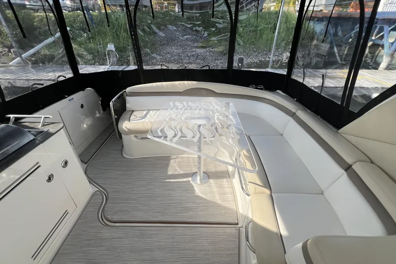  Yacht Photos Pics Luxurious interior of 2012 Sea Ray 370 Sundancer with elegant seating and modern design.