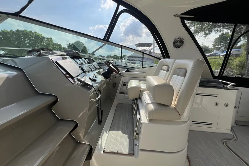  Yacht Photos Pics Interior of 2012 Sea Ray 370 Sundancer yacht with helm and seating area.