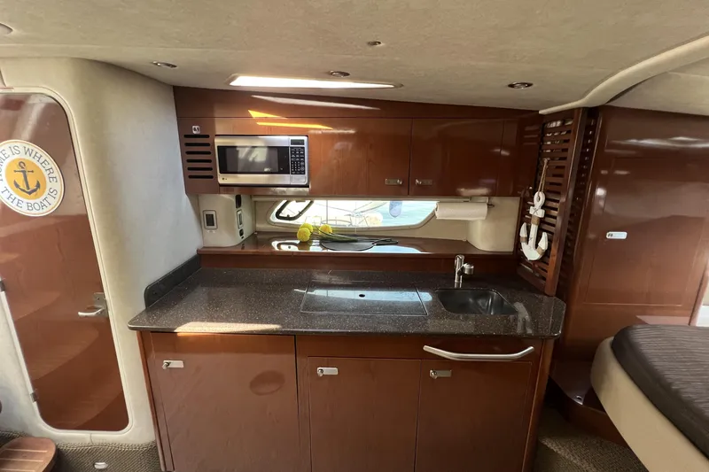  Yacht Photos Pics Interior of 2012 Sea Ray 370 Sundancer yacht with kitchenette and modern amenities.