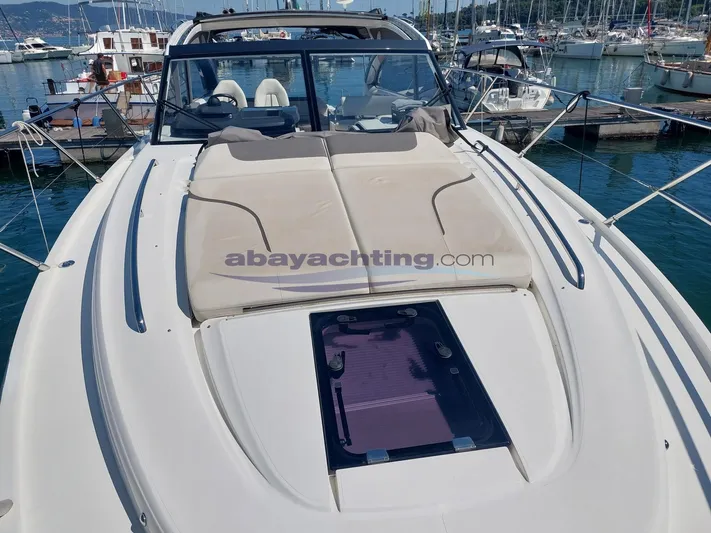  Yacht Photos Pics 2020 Princess V50 yacht with sunbathing area, docked in a marina.