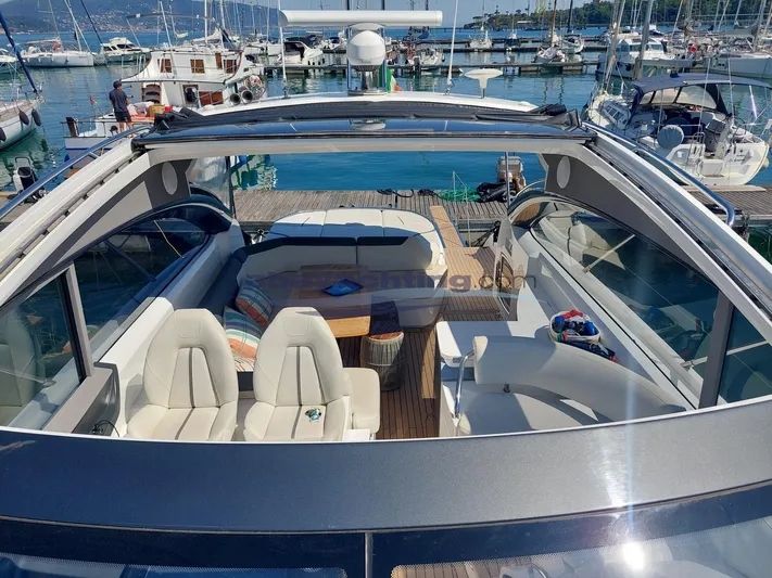  Yacht Photos Pics Luxury 2020 Princess V50 yacht interior with seating, docked at marina.