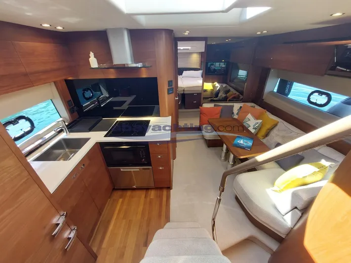  Yacht Photos Pics Luxurious 2020 Princess V50 yacht interior with modern kitchen and cozy seating area.