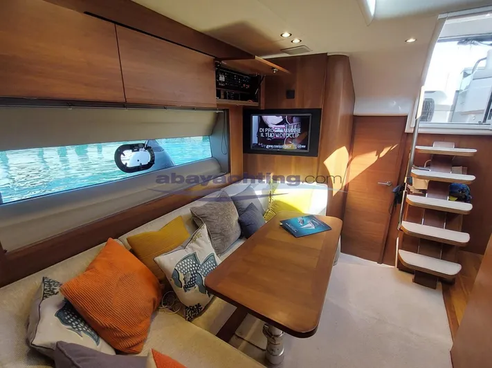  Yacht Photos Pics Luxurious interior of 2020 Princess V50 yacht with cozy seating and modern amenities.