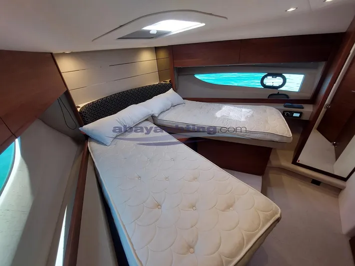  Yacht Photos Pics Luxurious cabin interior of 2020 Princess V50 yacht with twin beds and elegant wood finish.