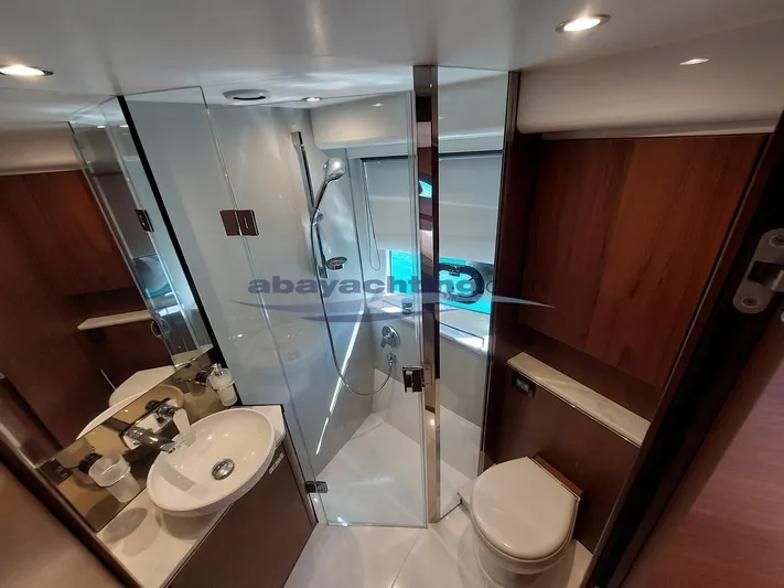  Yacht Photos Pics Luxurious bathroom in 2020 Princess V50 yacht with modern fixtures and wood accents.