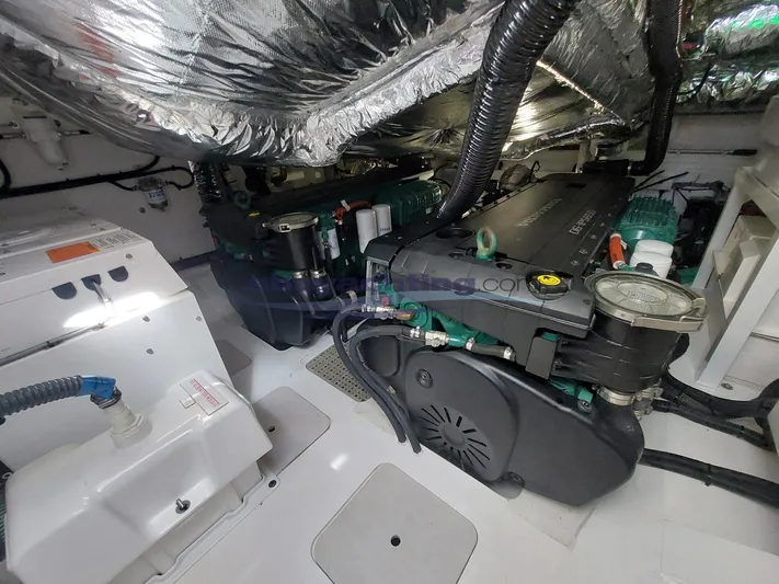  Yacht Photos Pics Engine room of a 2020 Princess V50 yacht, showcasing mechanical components and wiring.